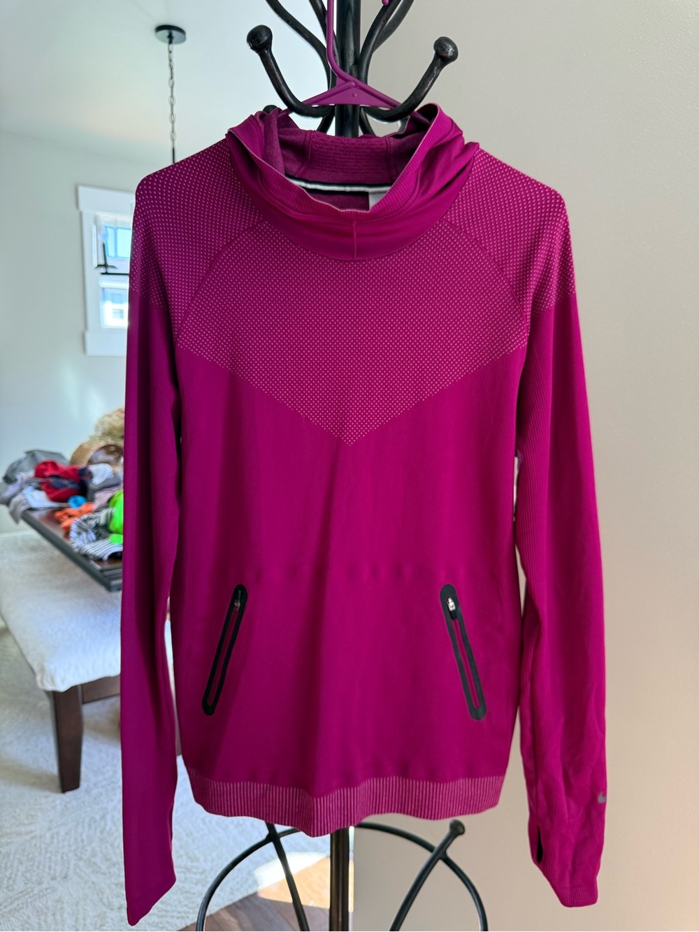 Nike Luxe Seamless Funnel Running Hoodie featuring dotmatrix chest panel